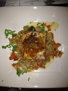 Hibachi Salmon. A colorful, visually pleasing dish. Salmon sitting on a bed of roasted vegetable quinoa, with spicy coconut sauce.